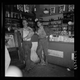 Coal miners buying groceries in a company store in West Virginia in 1938. Library of Congress/Marion Post Wolcott.